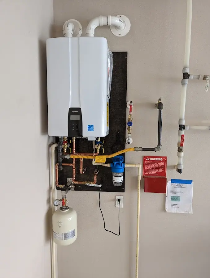 Professional plumber installing copper piping in a Lake Lakengren home